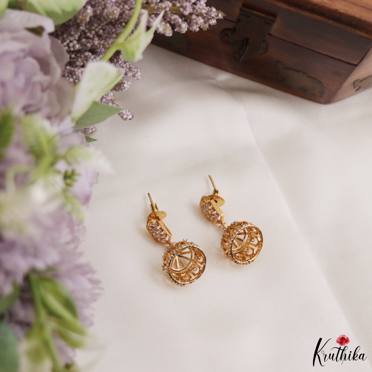 Simple White AD Gold tone Jhumkas E1236