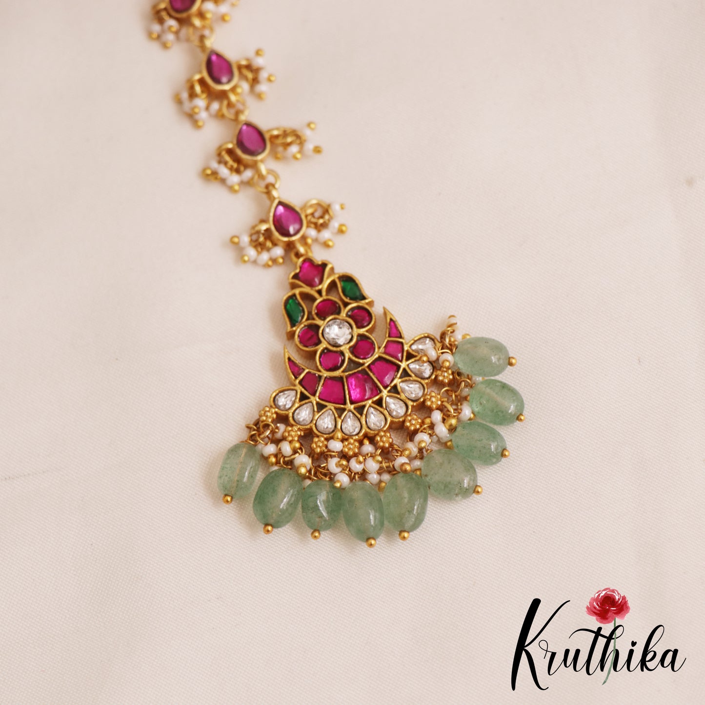 Elegant Floral Motifs Jadau Maang Tikka With Green Bead Drops E1050