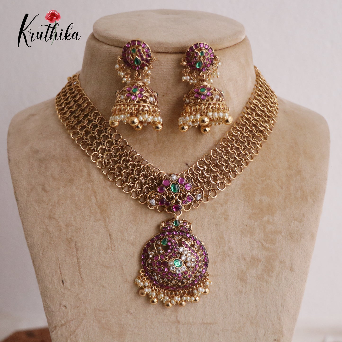 Classic Jadau Peacock Pendant Necklace with Golden Loop Chain Design and Jhumkas NC2178