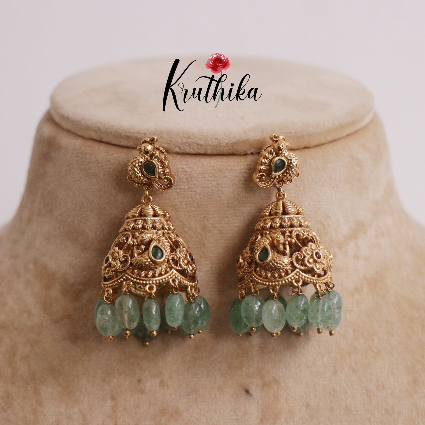 Beautiful AD Peacock Jhumka with Pastel Green Beads E659