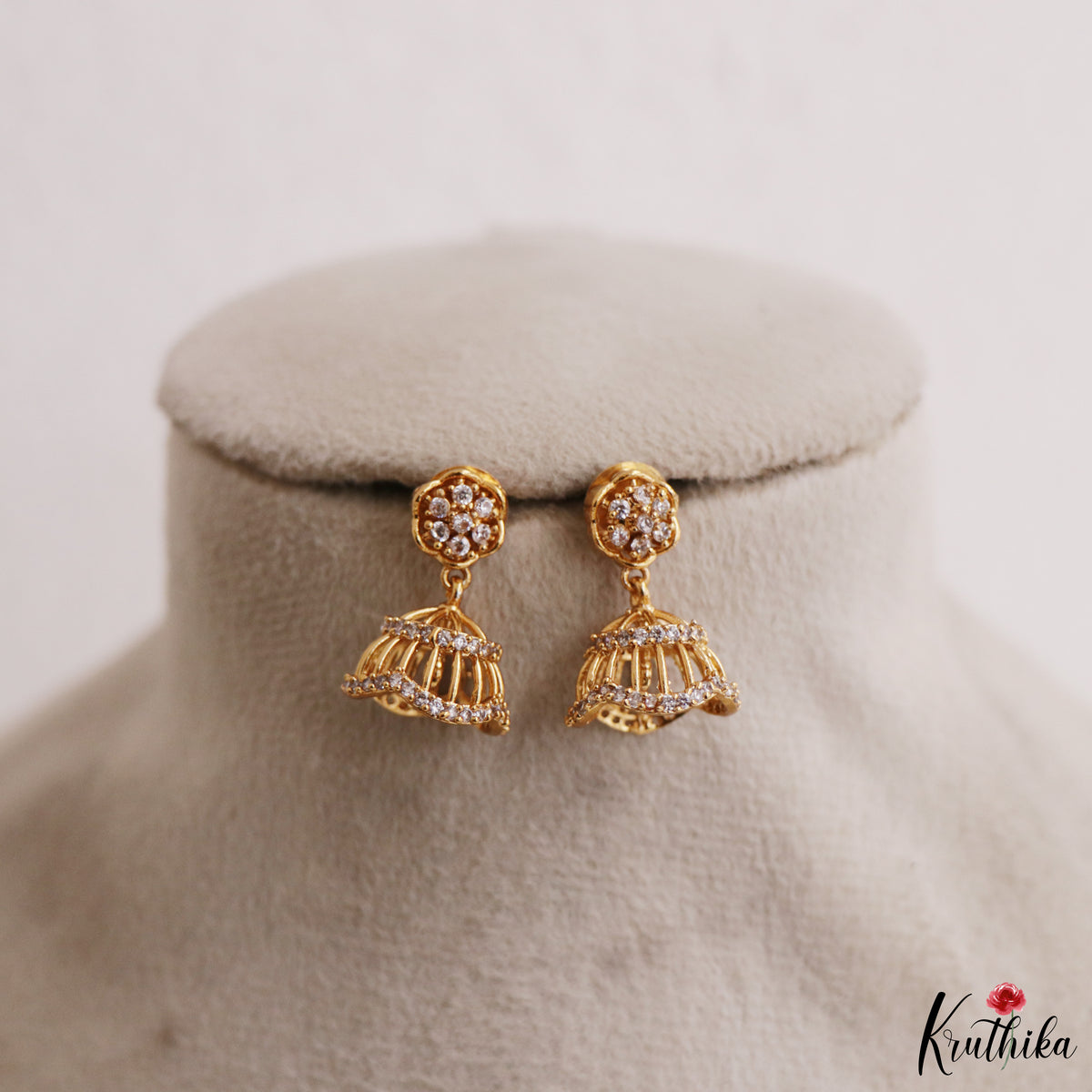 Simple White AD Gold tone Floral Jhumkas E1237