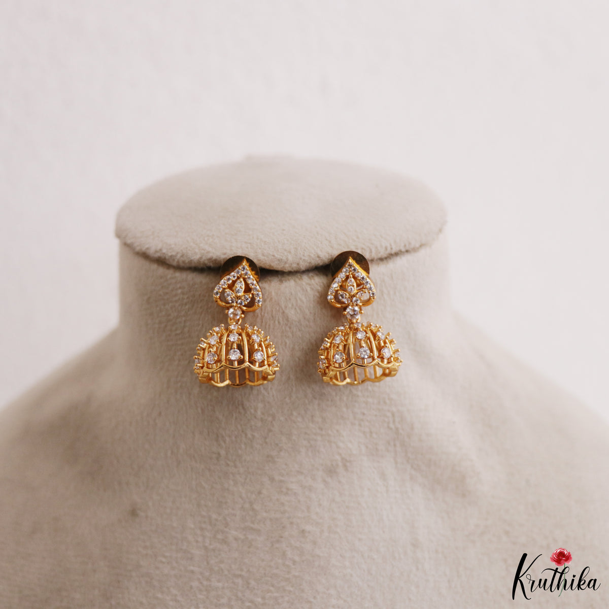 Simple White AD Gold tone Floral Jhumkas E1238