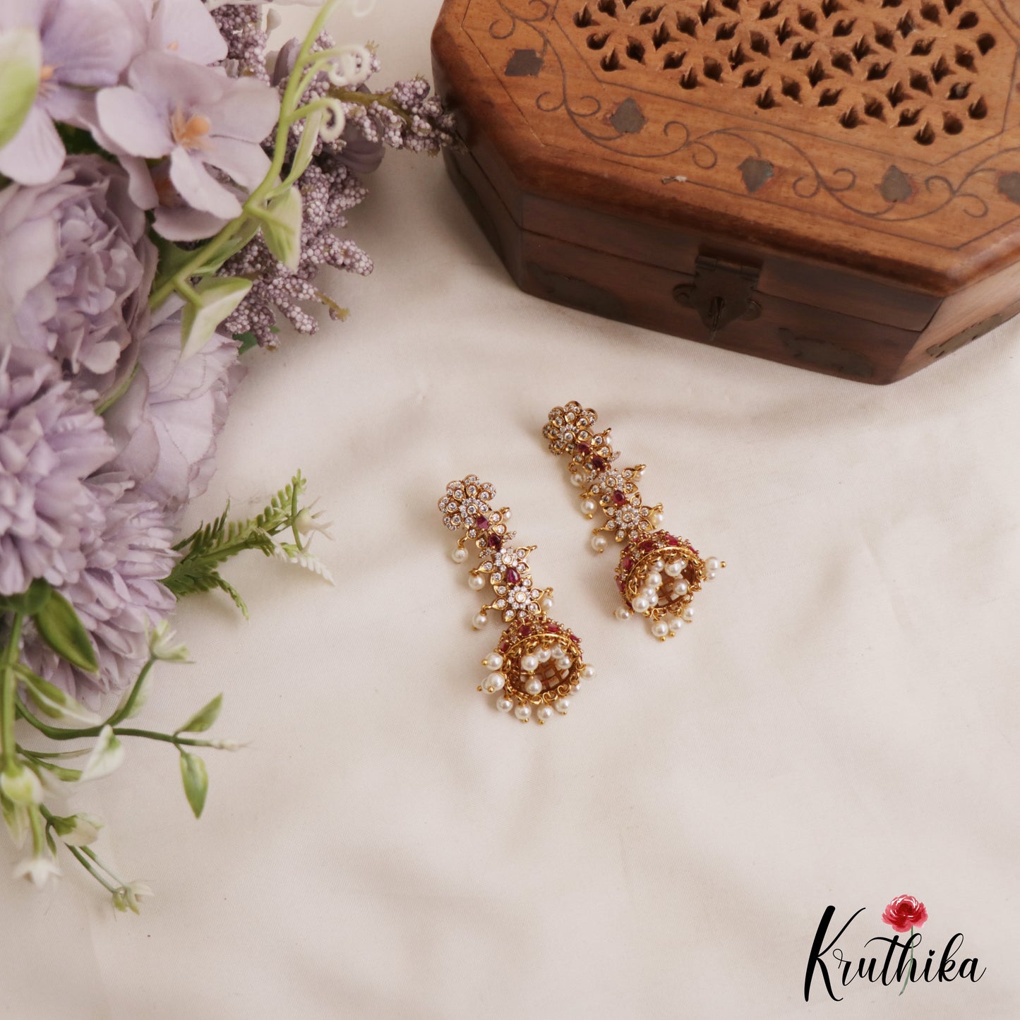 Sparkling Floral Motifs AD Jhumkas With Pearl Drops E1107 (Available In 4 Colors)