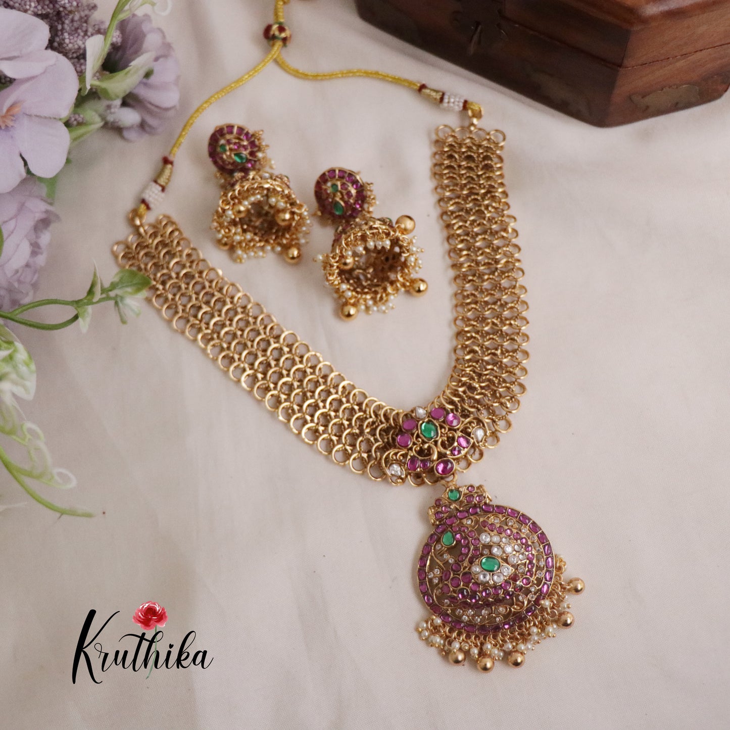 Classic Jadau Peacock Pendant Necklace with Golden Loop Chain Design and Jhumkas NC2178