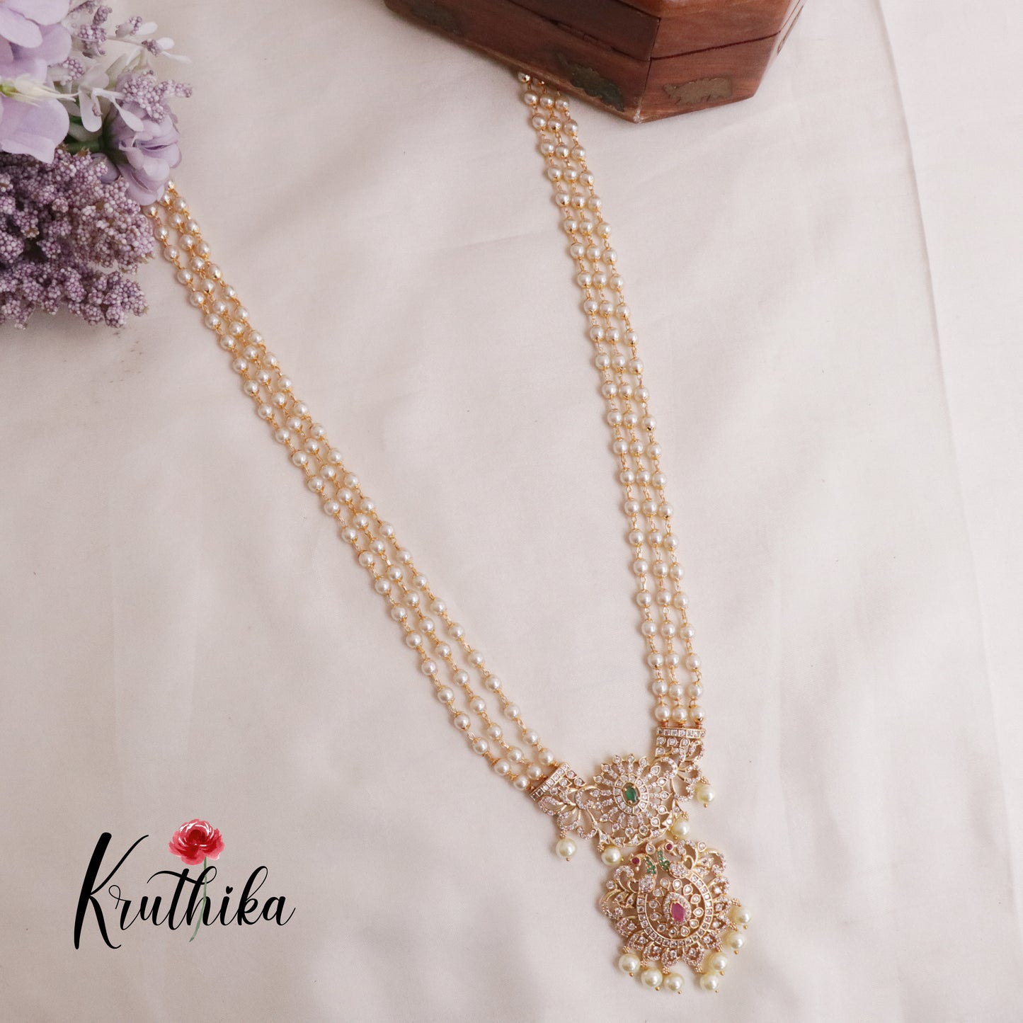 Elegant Three Layer Pearls Haaram with AD peacock pendant LH1890