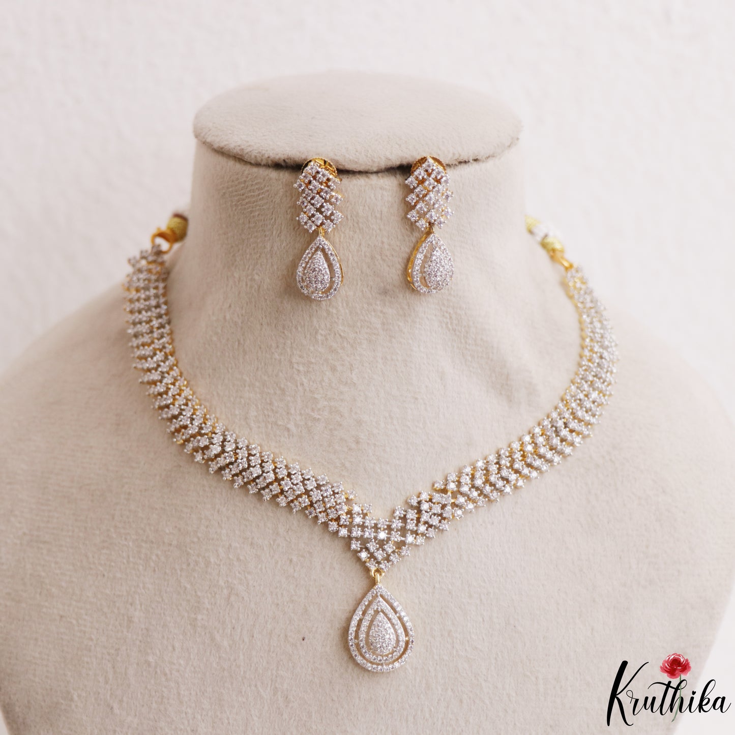 Elegant Teardrop Motifs Diamond-Finish Gold-Tone CZ Necklace NC3246