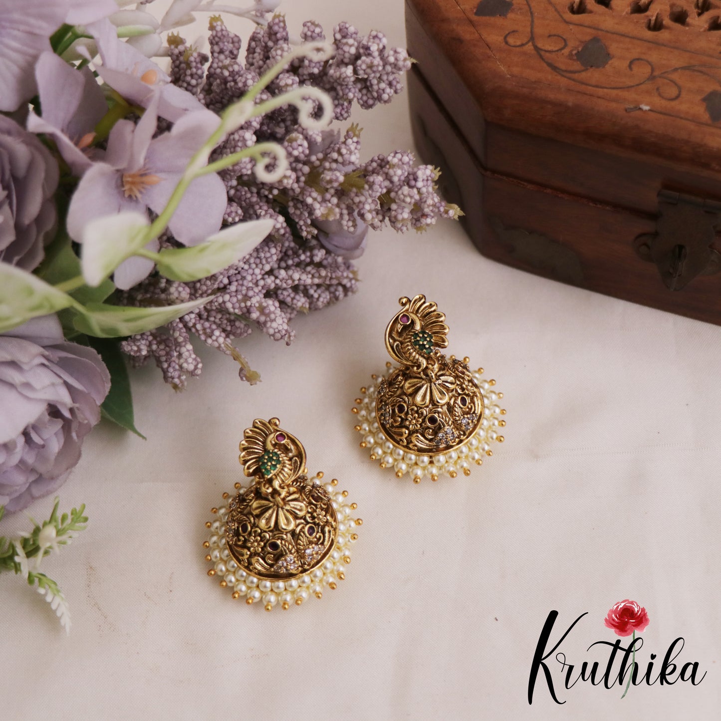 Beautiful Peacock Motifs Gold-Tone Jhumkas With Pearl Border E1072