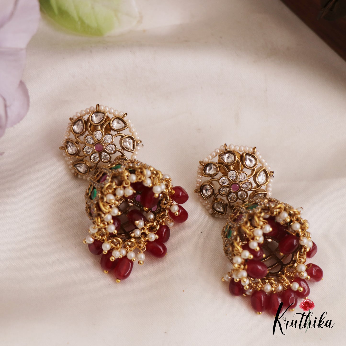 Sparkling Pearl Border Floral Motifs Jhumka With Bead Drops E986 (Available In 2 Colors)