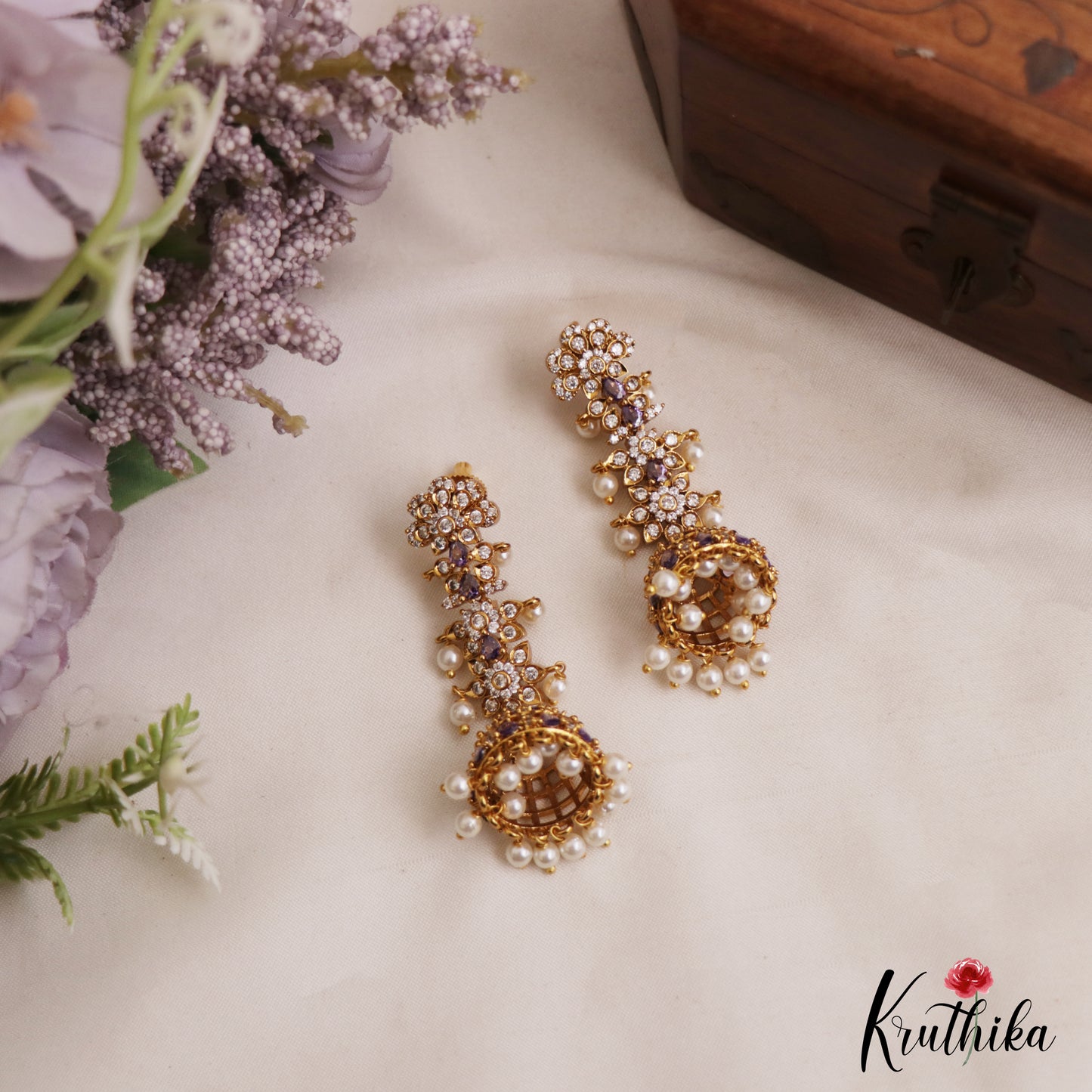 Sparkling Floral Motifs AD Jhumkas With Pearl Drops E1107 (Available In 4 Colors)