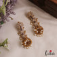 Sparkling Floral Motifs AD Jhumkas With Pearl Drops E1107 (Available In 4 Colors)