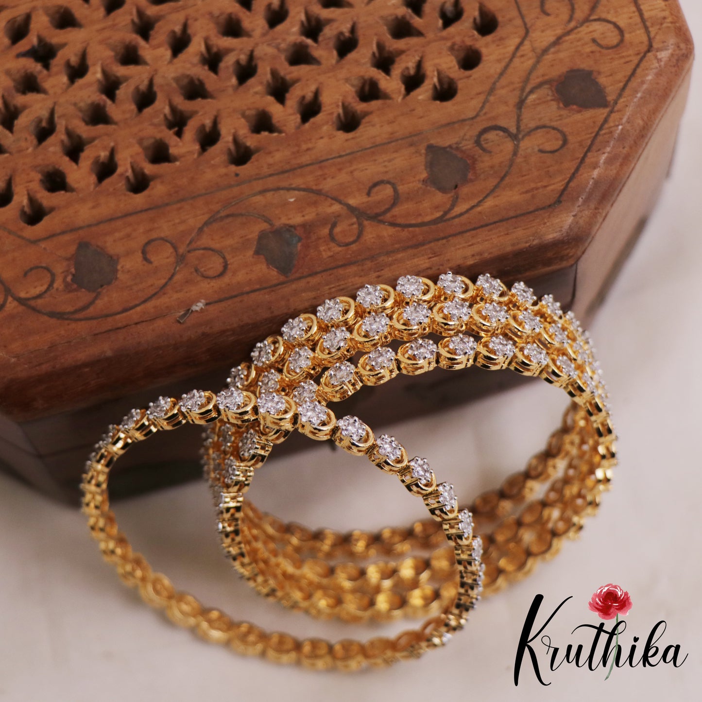 Pretty Floral Motifs Diamond-Finish Gold-Tone AD Bangles B518 (Set Of 4)
