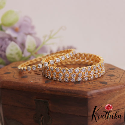 Pretty Floral Motifs Diamond-Finish Gold-Tone AD Bangles B518 (Set Of 4)