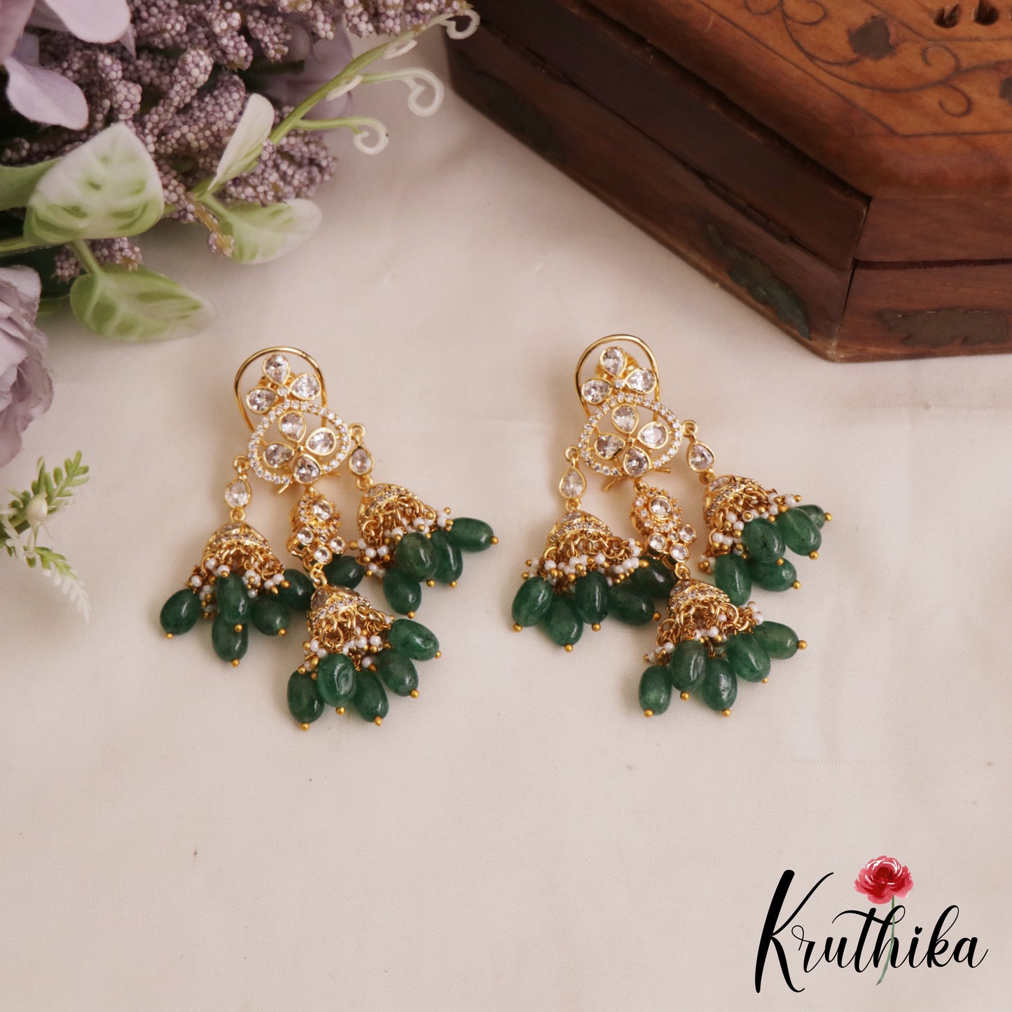 Sparkling Teardrop Motifs Chandelier AD Jhumka Earrings With Green Bead Drops E1038