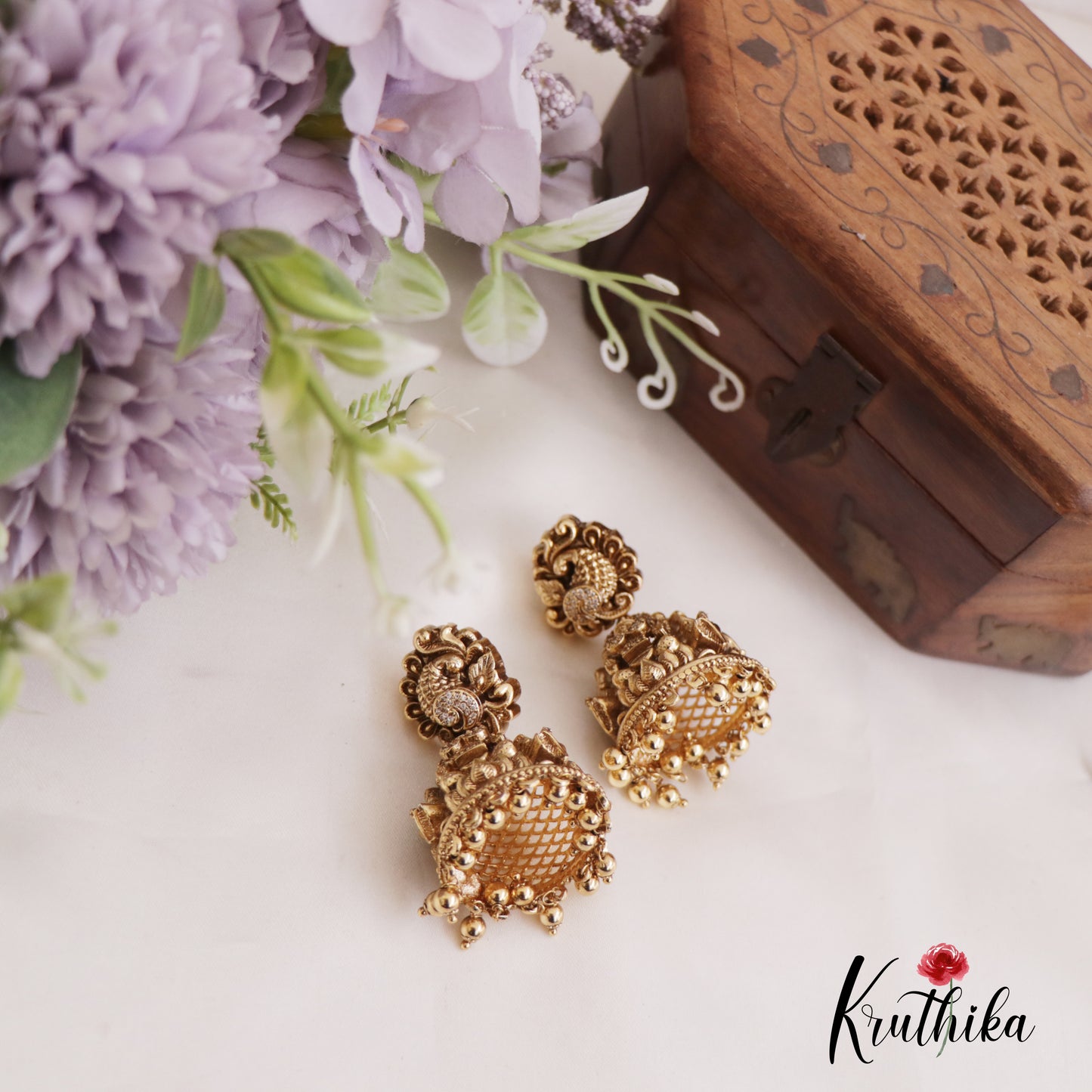 Beautiful Lakshmi Peacock Jhumkas with Golden Beads Drops E902