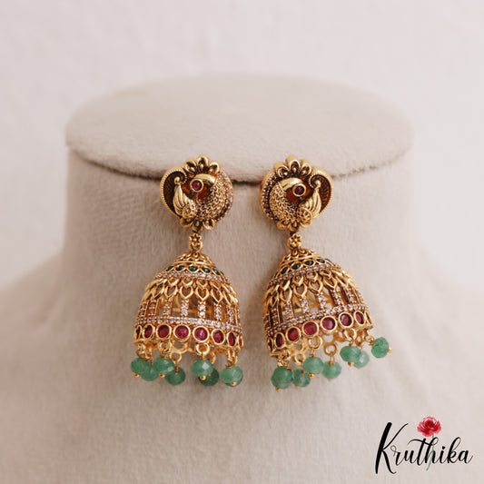 Trendy Antique Peacock Motifs Jadau Jhumkas With Green Bead Drops E1162 (Available In 2 Colors)