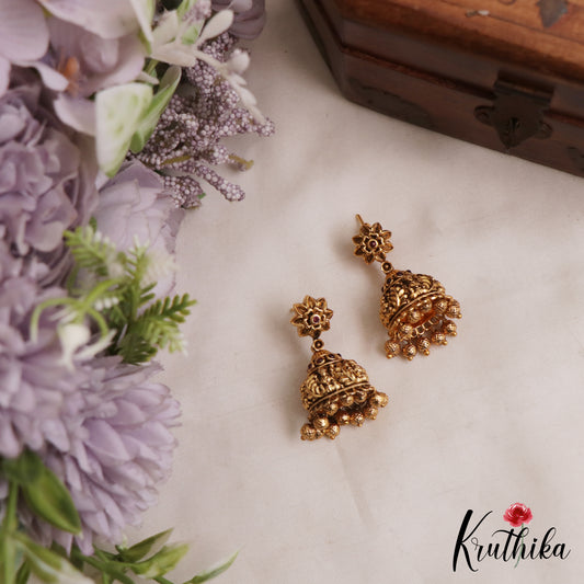 Beautiful Antique Floral Lakshmi Motifs Jhumkas With Golden Bead Drops E1166 (Available In 2 Colors)