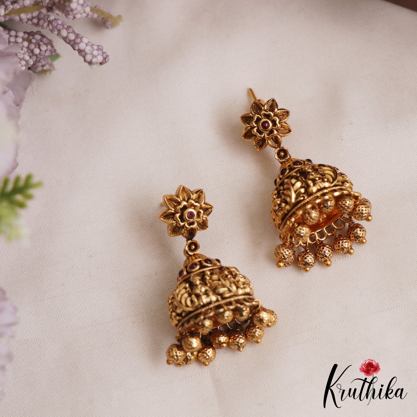Beautiful Antique Floral Lakshmi Motifs Jhumkas With Golden Bead Drops E1166 (Available In 2 Colors)