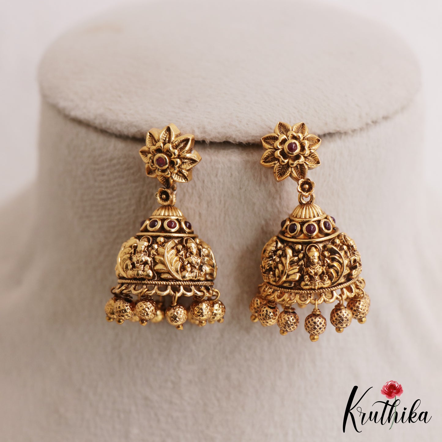 Beautiful Antique Floral Lakshmi Motifs Jhumkas With Golden Bead Drops E1166 (Available In 2 Colors)