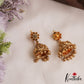 Beautiful Antique Floral Lakshmi Motifs Jhumkas With Golden Bead Drops E1166 (Available In 2 Colors)