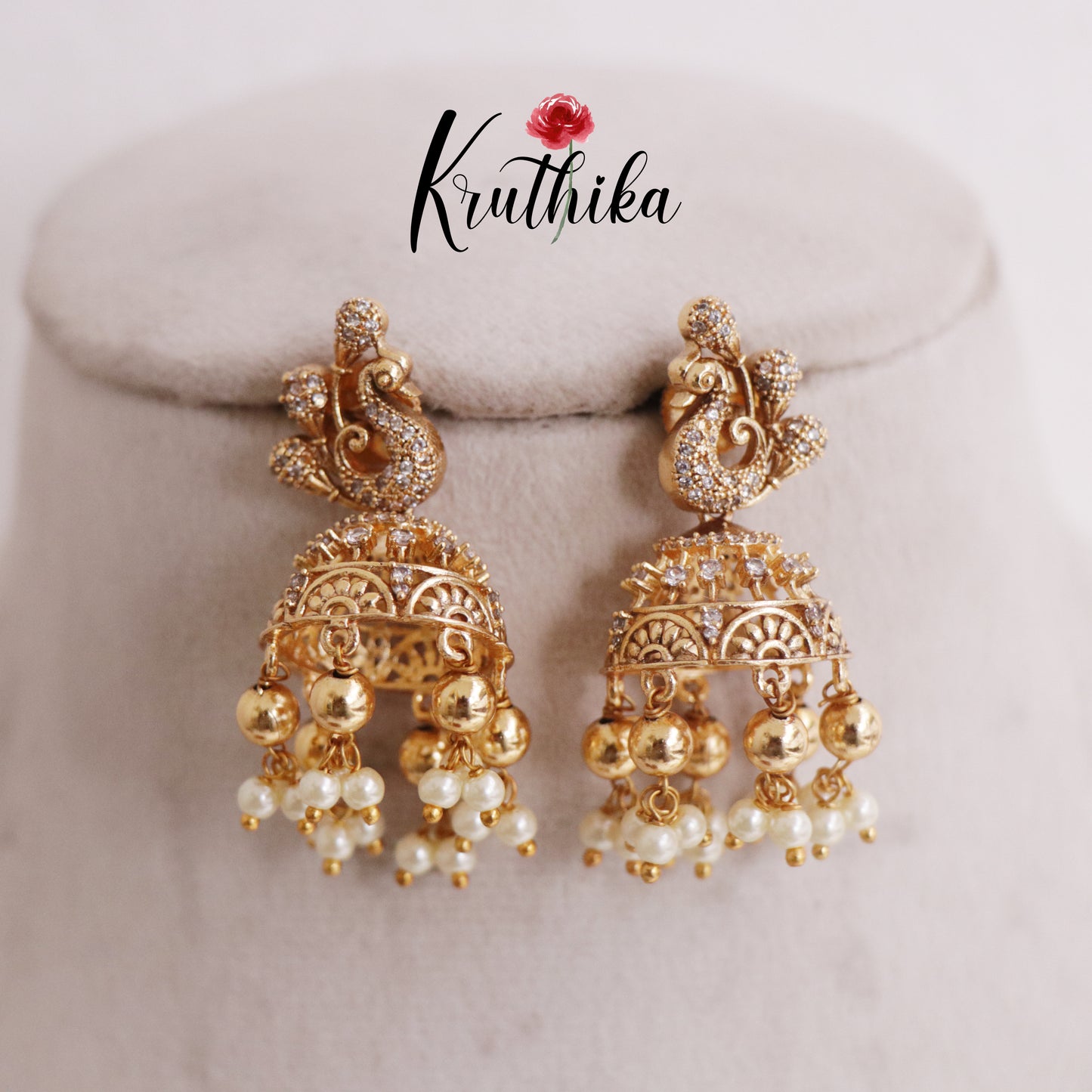 Cute AD Peacock Jhumka with Pearls & golden Beads Drops E759