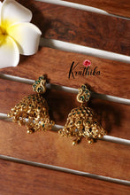 Trendy peacock emerald jhumkas E369