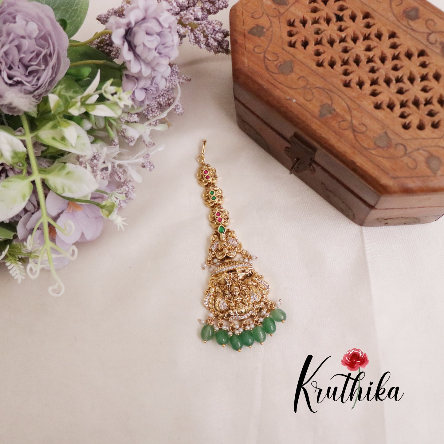 Premium CZ Jadau Temple Lakshmi Devi Peacock Design Maang Tikka with Green Beads MT251