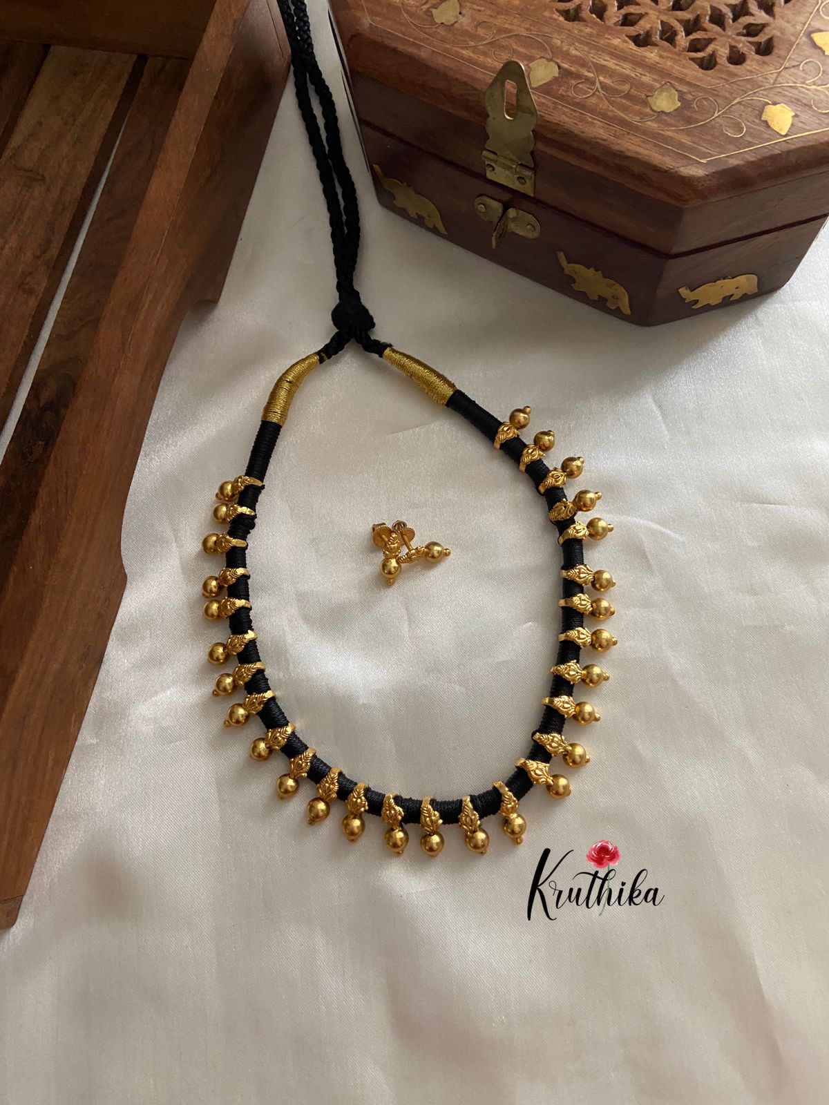 Buy Tribal Necklace Brass Balls embedded in Black Thread - Ritikart