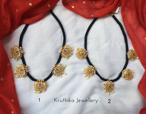 Black thread necklace with geru gold polish pendants